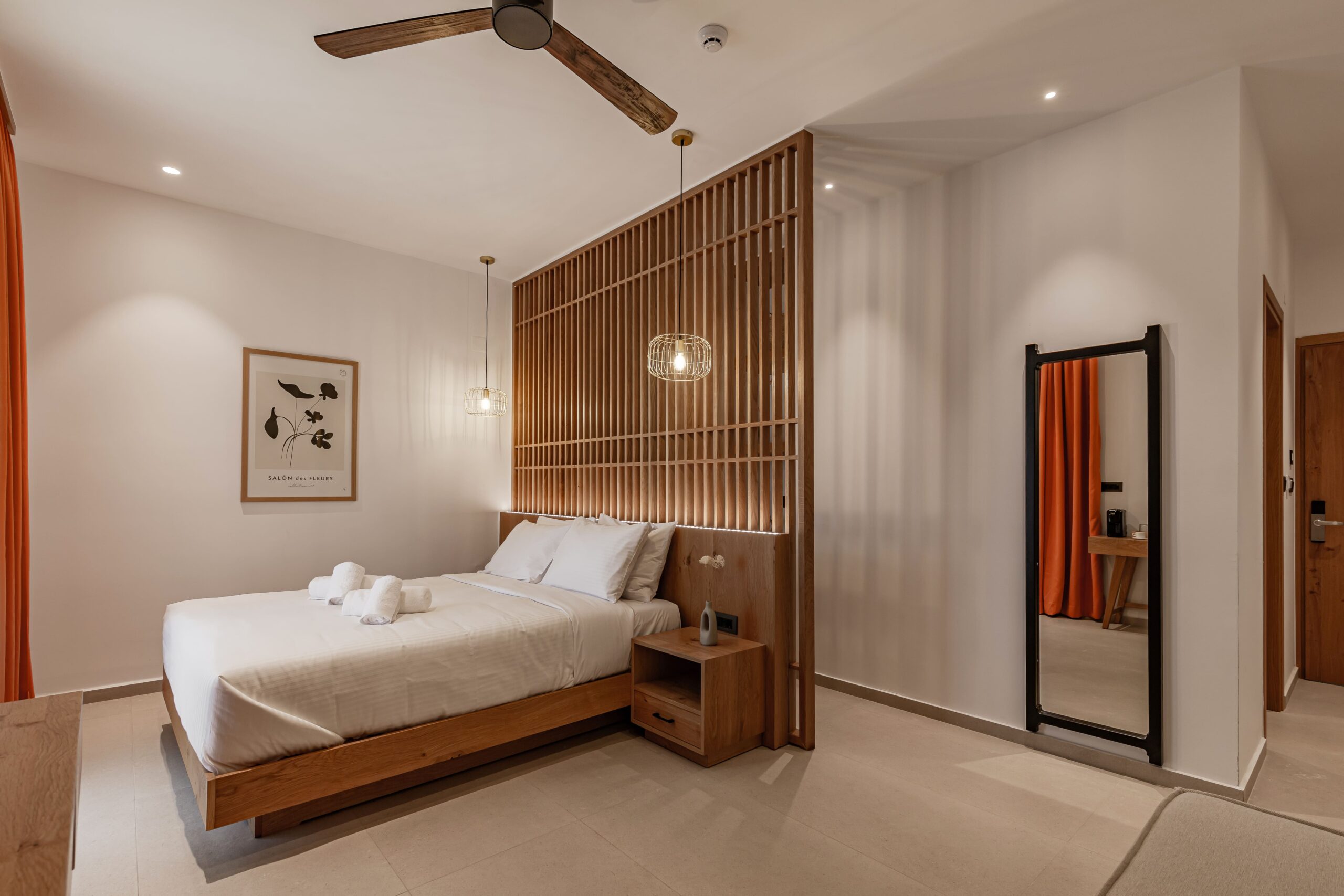 Spacious room featuring a large bed and natural tones